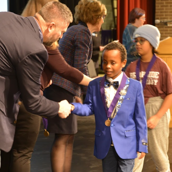  Student receives award and shakes hands